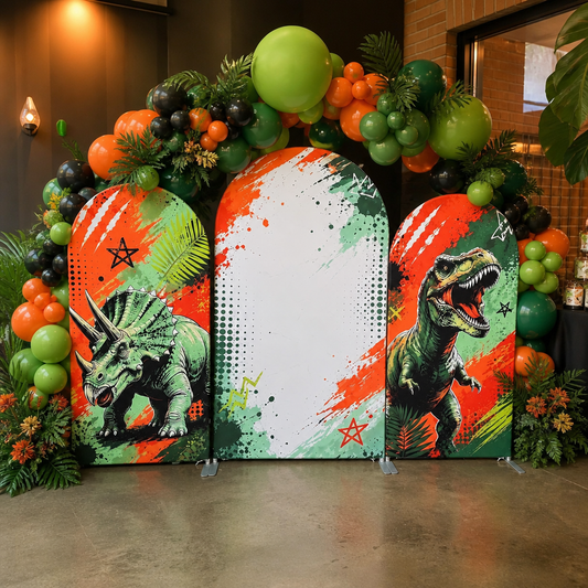 Dinosaur themed party setup with balloon decorations and arch backdrop