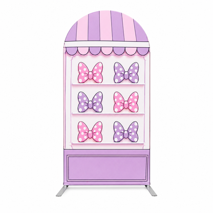 Close-up of purple bow section on arch backdrop