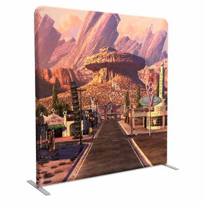 Angled view of Route 66 desert scenic tension fabric backdrop on stand