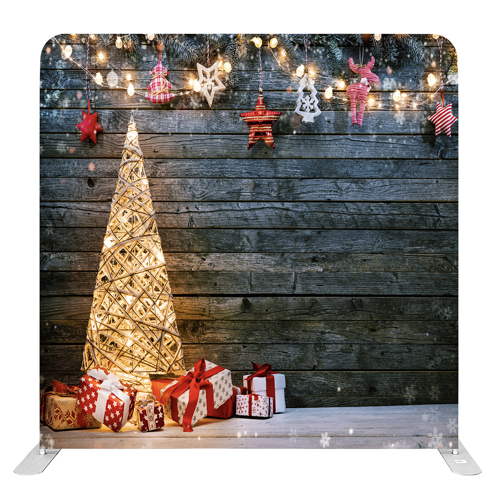 Isolated Christmas backdrop with lighted tree and gift boxes