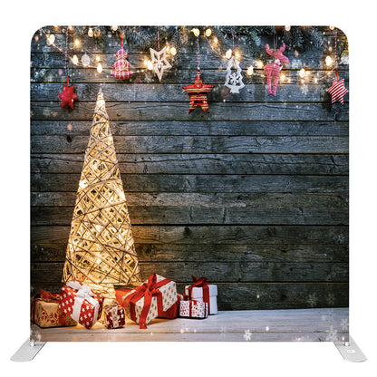 Isolated Christmas backdrop with lighted tree and gift boxes