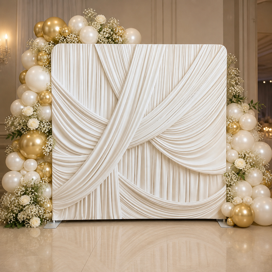 Ivory draped fabric photo booth backdrop with balloon floral decor
