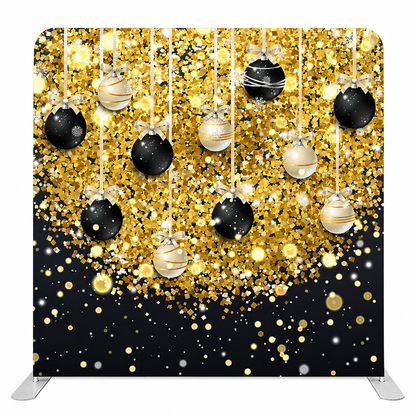 Gold and black hanging ornaments confetti backdrop