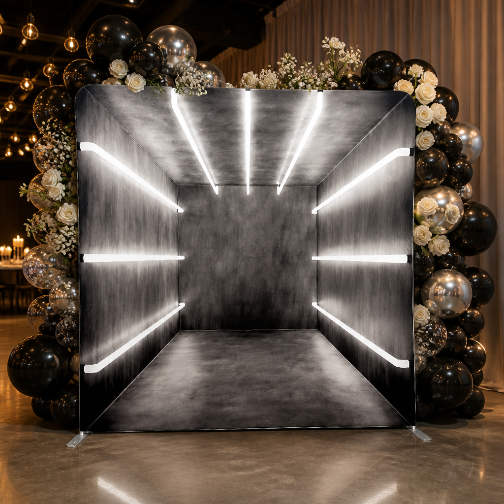 Event setup with modern gray backdrop and balloon decorations