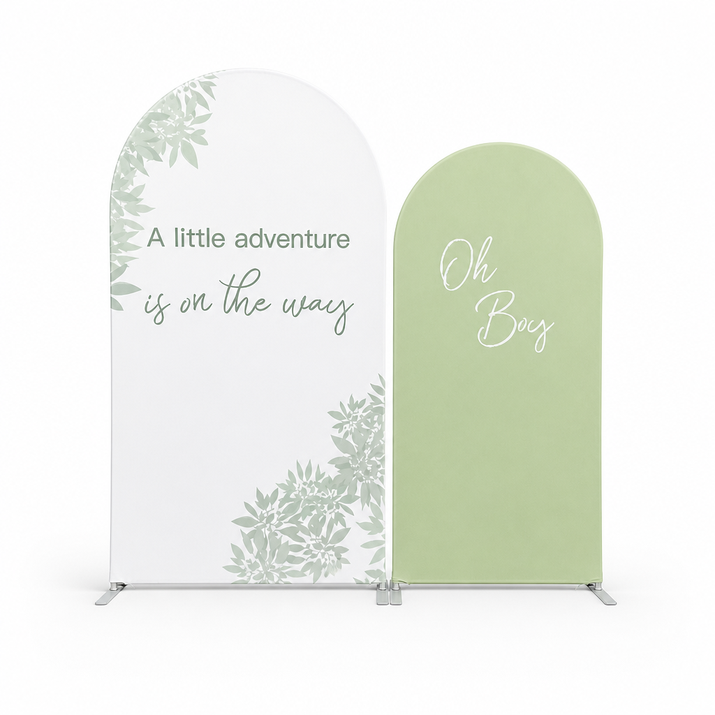 Green botanical arch backdrop fabric cover with 'A little adventure is on the way' text