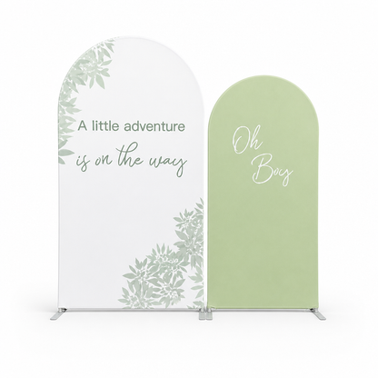 Green botanical arch backdrop fabric cover with 'A little adventure is on the way' text