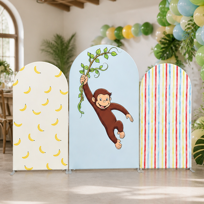 Closeup of arch backdrop covers with monkey and banana theme in party setting