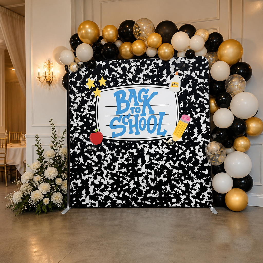 Backdrop set with stand decorated with balloon garland at school party venue