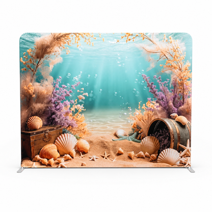 Ocean themed tension fabric backdrop with treasure chest and starfish