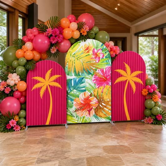 Indoor party decoration featuring tropical arch backdrop and balloons