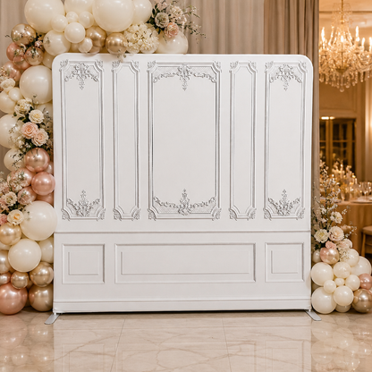 Wedding event set up with white classic panel backdrop and balloon decorations
