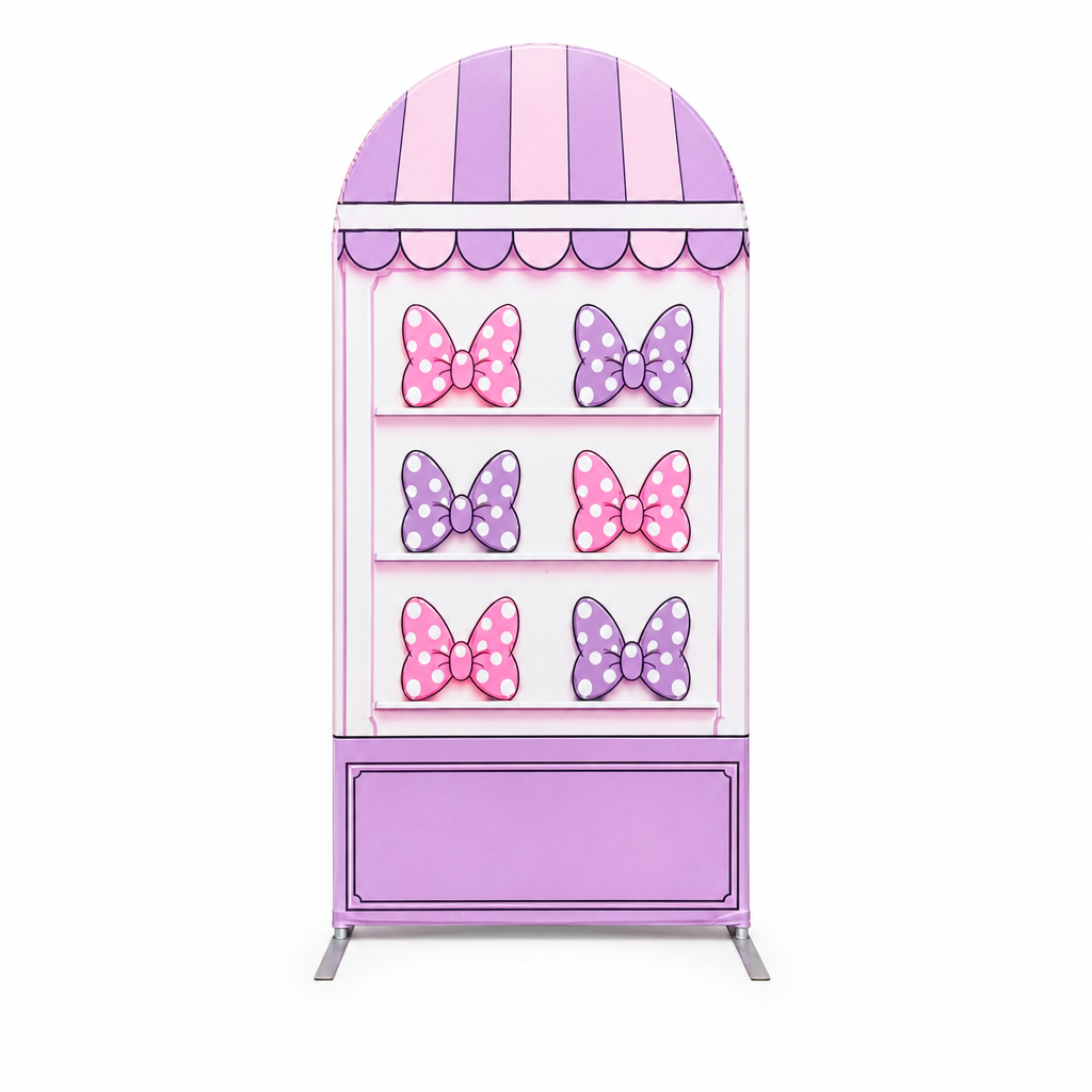 Front view of arch backdrop with pink and purple bows