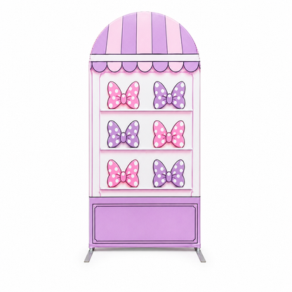Front view of arch backdrop with pink and purple bows
