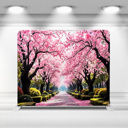 Cherry blossom backdrop setup indoors with balloons and floral decor