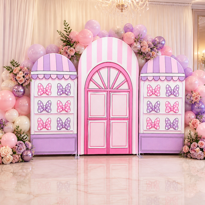 Polka dot bow themed party backdrop with balloon decoration