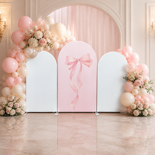 Pink ribbon arch backdrop with pink and cream balloon decorations