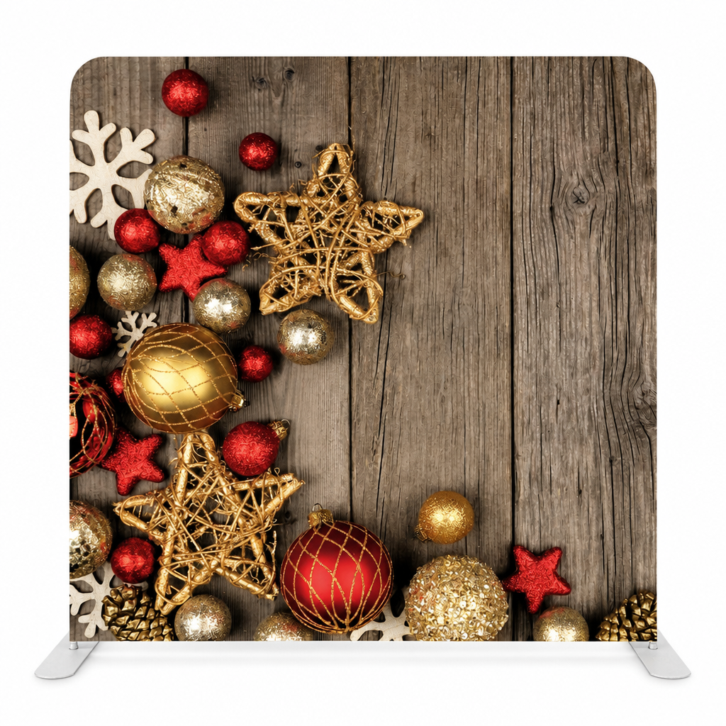 Rustic Christmas backdrop with gold and red ornaments on wood